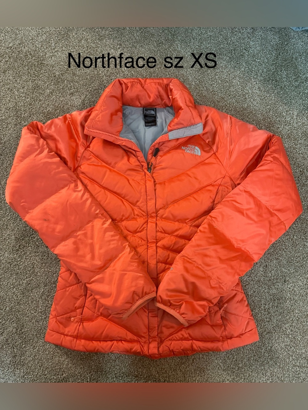 The North Face Women's Orange Quilted Jacket Sz XS has a few marks seen in pics